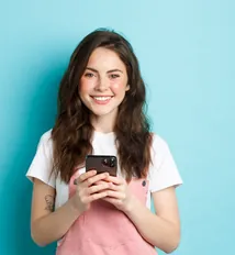 Woman smiling at her phone